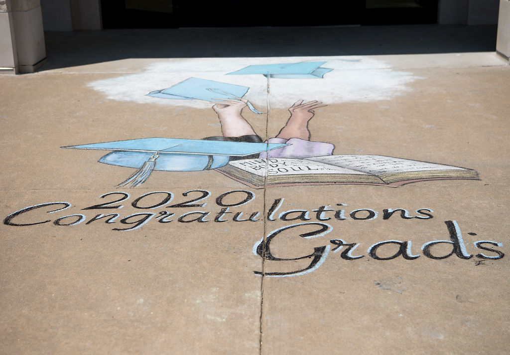Sidewalk chalk art congratulating graduates